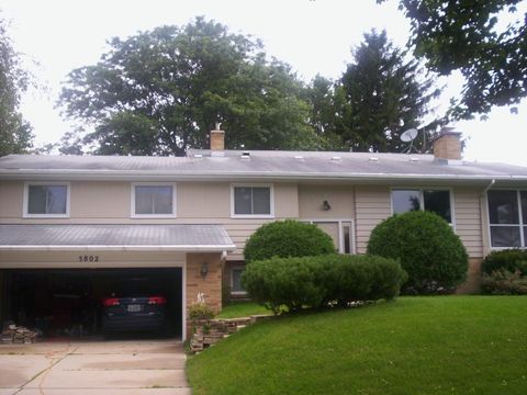 New White Gutters and Leafree after re-roof on Home in Madison.